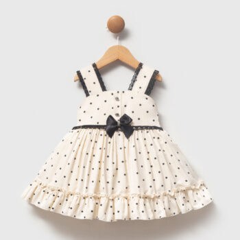 βρεφικό φόρεμα πουά εκρού με μαύρο φιόγκο για κορίτσι
