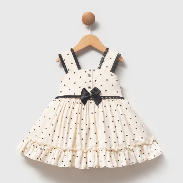 βρεφικό φόρεμα πουά εκρού με μαύρο φιόγκο για κορίτσι